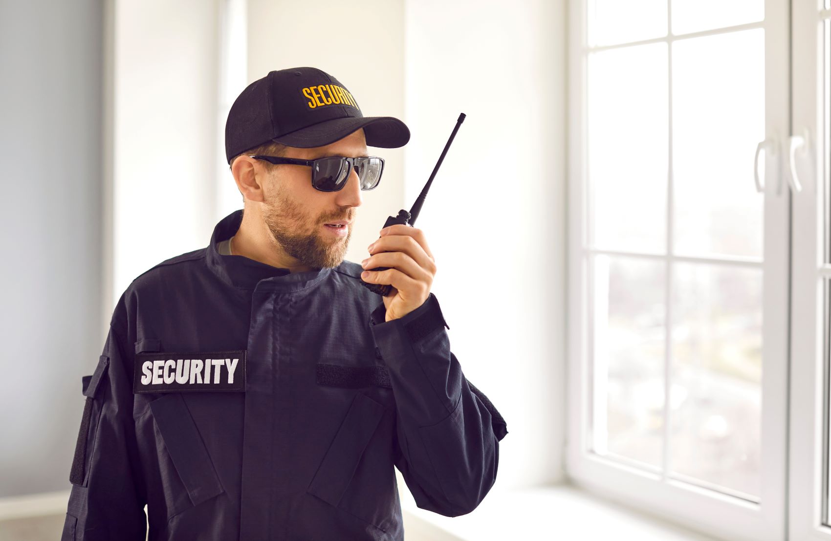 security guard communicating with P25 radio