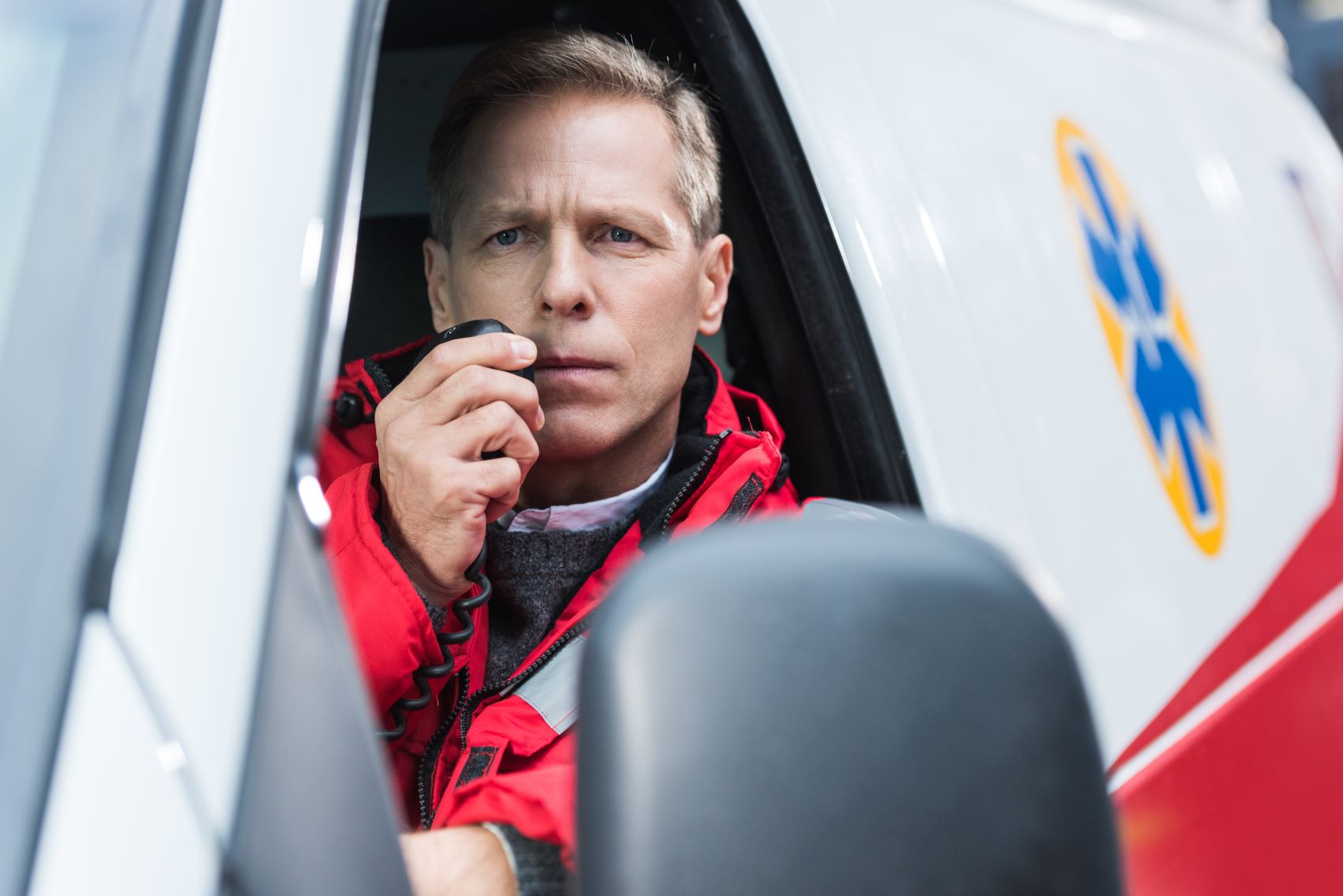 person in public safety responding to emergency using long-range two-way radio