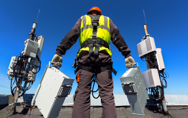 man carrying equipment