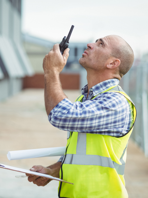 man with radio looking up
