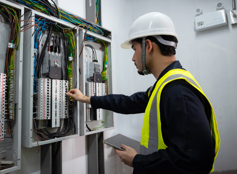 man checking wires