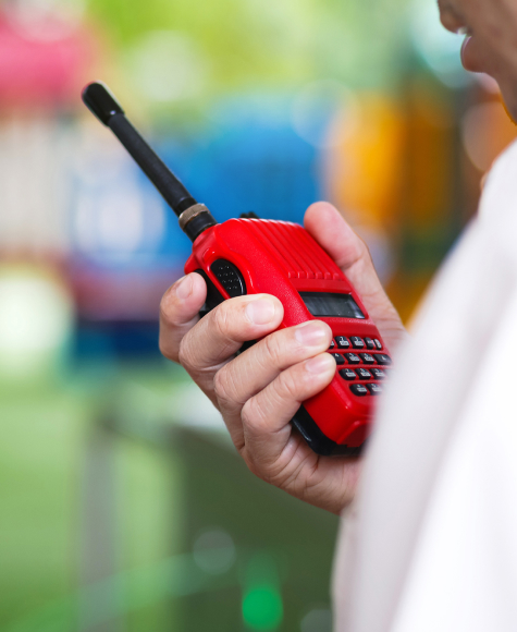 close up of a hand holding a radio