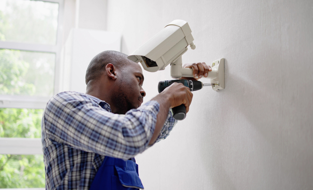 man installing camera