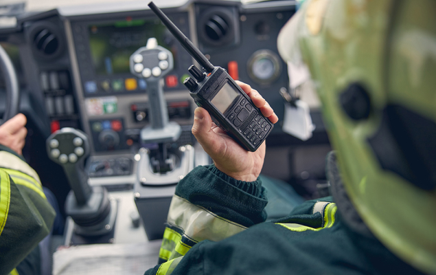 hand holding a radio